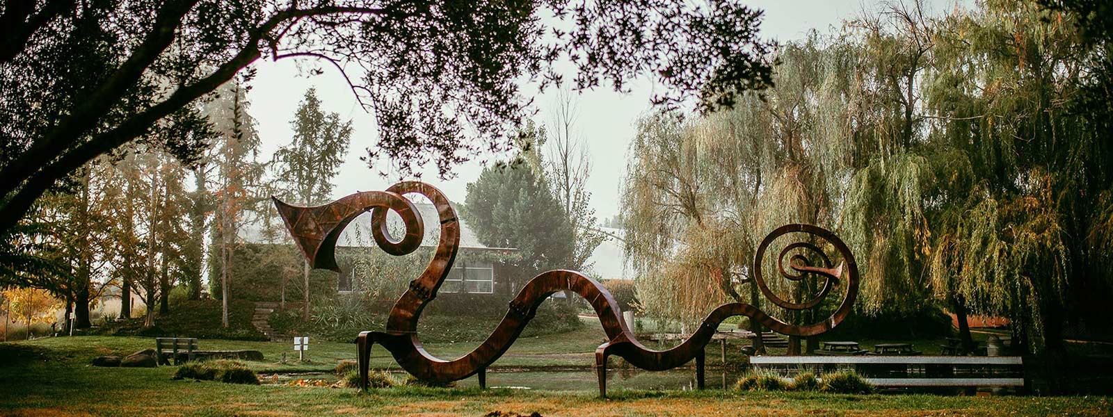 Serpent sculpture by our central pond
